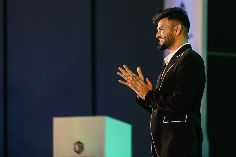 Purushottam reflecting on stage